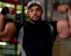 Bodybuilder with biceps the same size as mans waist breaks world record