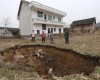 PHOTOS: Chinese village being swallowed by sink holes after suffering 20 cave-ins in just five months