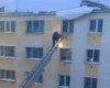 VIDEO: Russian firefighter hit by snow while climbing ladder
