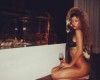 Rihanna poses almost nude with glass of wine in racy photos